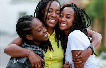 Three women hugging