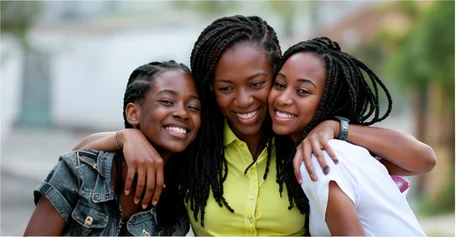 Three women smiling
